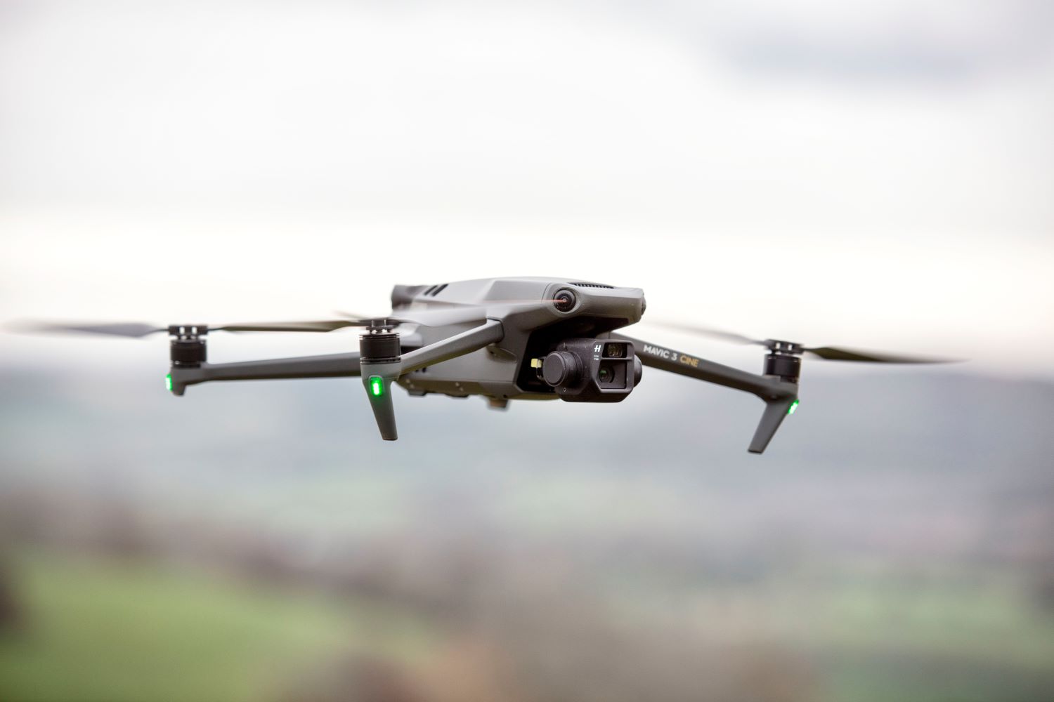 A flying drone against a blurry background