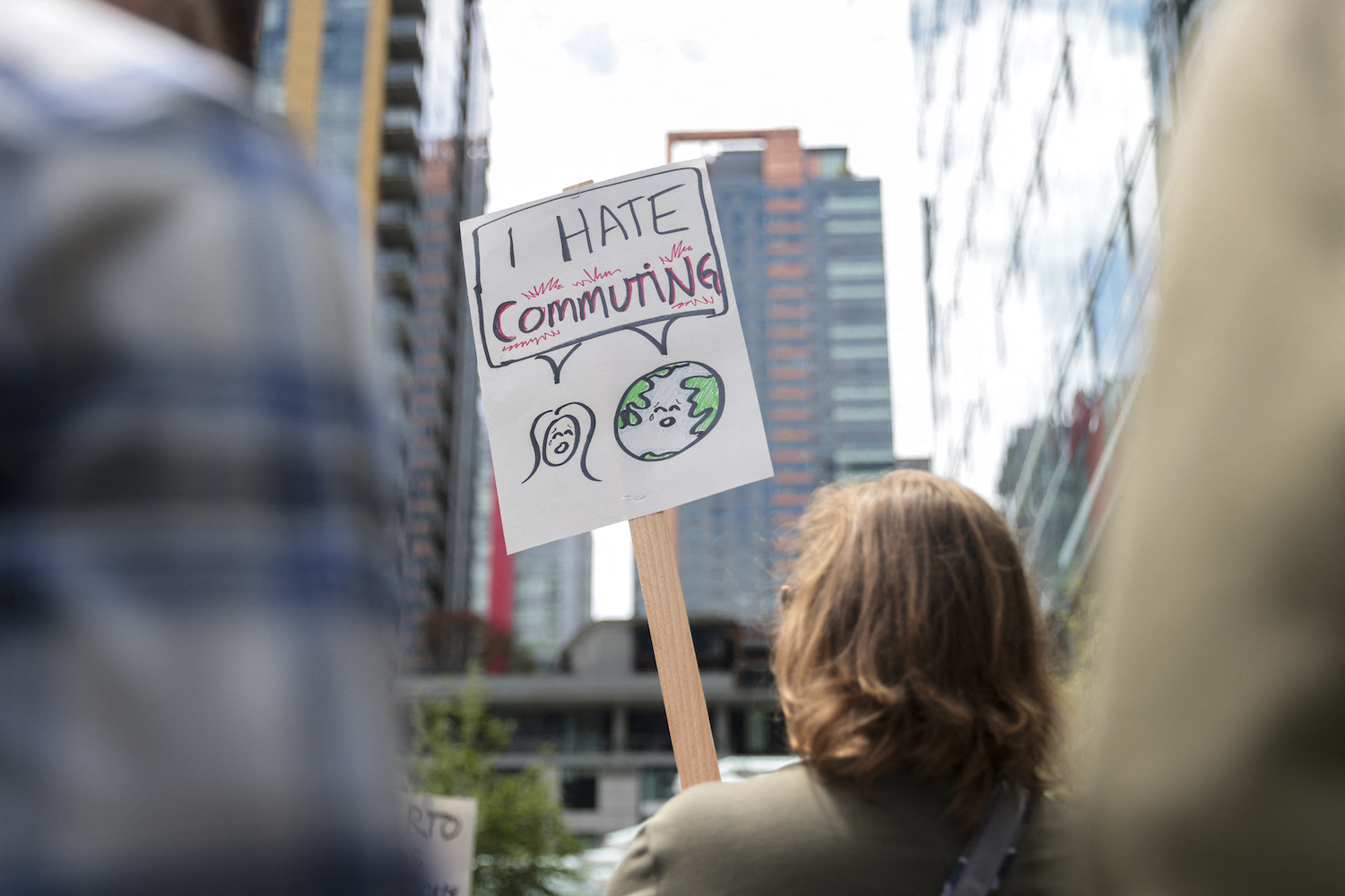 A protester holds a sign in front of Amazon's Seattle headquarters