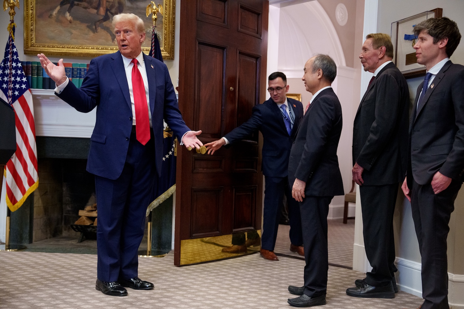 Donald Trump, accompanied by (R-L) , OpenAI CEO Sam Altman, SoftBank CEO Masayoshi Son, and Oracle CTO Larry Ellison speaks as he leaves a news conference in the Roosevelt Room of the White House on January 21, 2025 in Washington, DC.