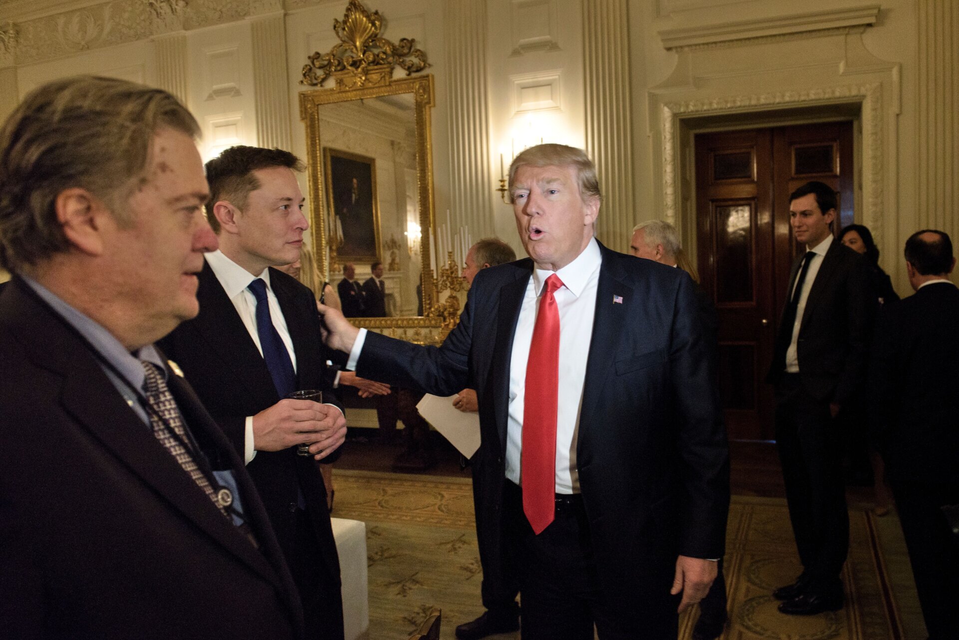 Steve Bannon watches as President Donald Trump greets Elon Musk