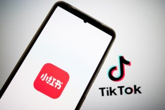 The RedNote logo appears on a smartphone screen, and the TikTok logo appears on a computer screen as the background in this photo illustration in Athens, Greece, on January 15, 2025.