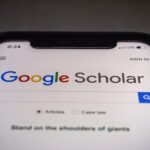 A phone on Google Scholar's landing page.