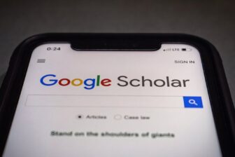 A phone on Google Scholar's landing page.