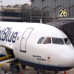 A JetBlue plane parked at gate 26 at Ronald Reagan Washington National Airport.