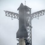 The SpaceX Starship rocket on the launch bad in foggy weather.