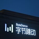 A night-time shot of a building with the ByteDance logo and Chinese characters.