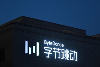 A night-time shot of a building with the ByteDance logo and Chinese characters.