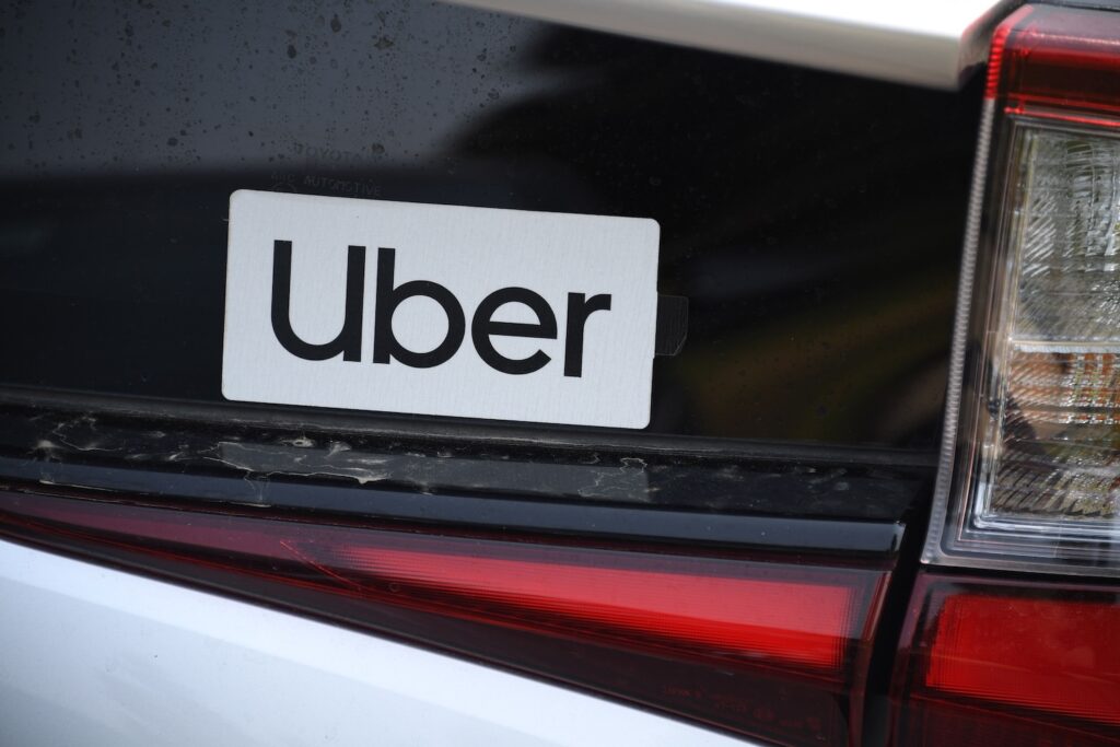 An Uber sticker is seen on a car at the start of a protest by ride share drivers on August 20, 2020 in Los Angeles, California.