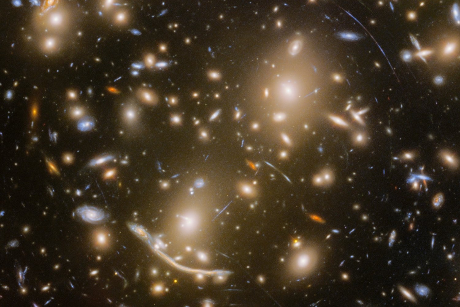 The galaxy cluster Abell 370, containing the star-filled Dragon Arc, as seen by the Hubble Space Telescope.