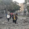 Families flee their shattered neighbourhood, Tal al-Hawa, to seek refuge in the southern Gaza strip.