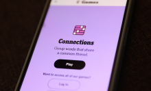 A close-up of an NYT Connections game on a smartphone.