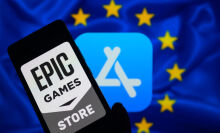 Epic Games Store logo on phone screen in front of Apple App Store logo