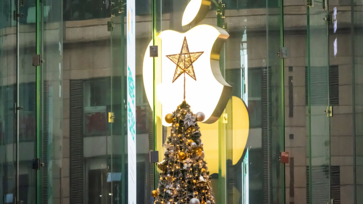 Christmas tree with star on top in front of Apple logo in China