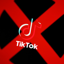 A large red "X" over the TikTok logo