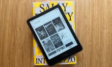 A Kindle Paperwhite on a copy of Intermezzo by Sally Rooney