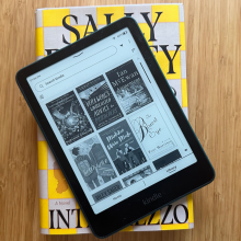 A Kindle Paperwhite on a copy of Intermezzo by Sally Rooney