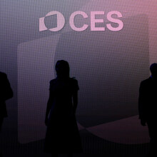 Silhouettes of CES attendees in front of a purple backdrop. 