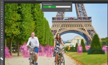 Two people ride bikes in Paris beneath the Eiffel Tower with people behind them highlighted in pink.