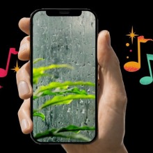 iPhone showing rain on the screen with music notes in the background