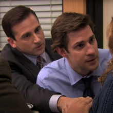 Three men comforting a woman as she goes into labor.