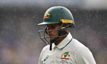 Usman Khawaja of Australia leaves the field