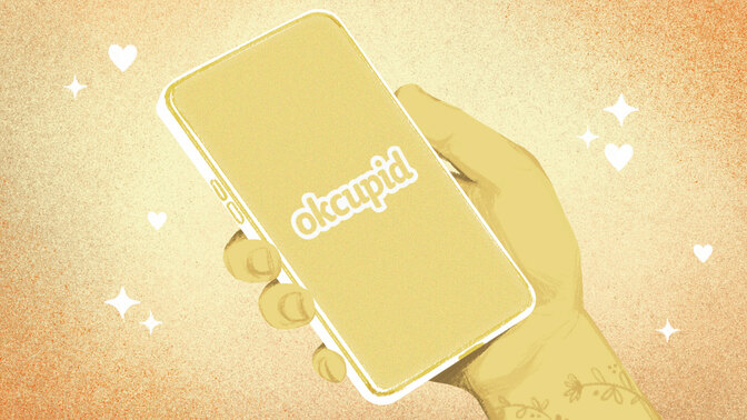 A drawn hand holding a phone with the okcupid logo 