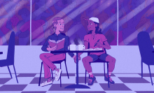 two people sitting in a coffee shop