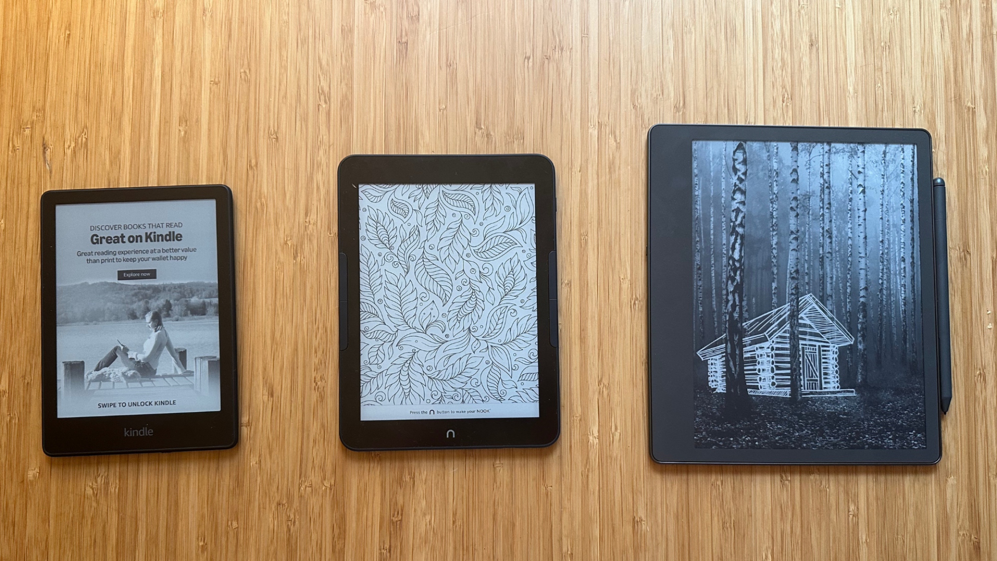 A Kindle Paperwhite, a Nook GlowLight 4 Plus, and a Kindle Scribe