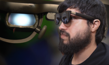 a profile view of a man wearing xreal's AR glasses