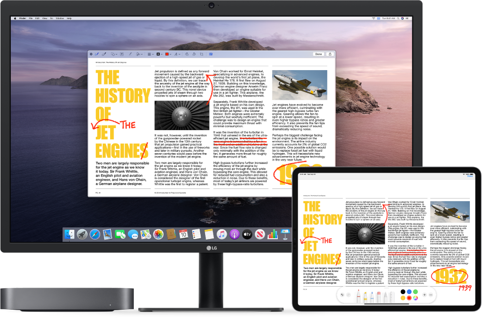 A Mac Mini and an iPad sit side by side. Both screens display an article covered in scribbled red edits, such as crossed out sentences, arrows, and added words. The iPad also has mark up controls at the bottom of the screen.