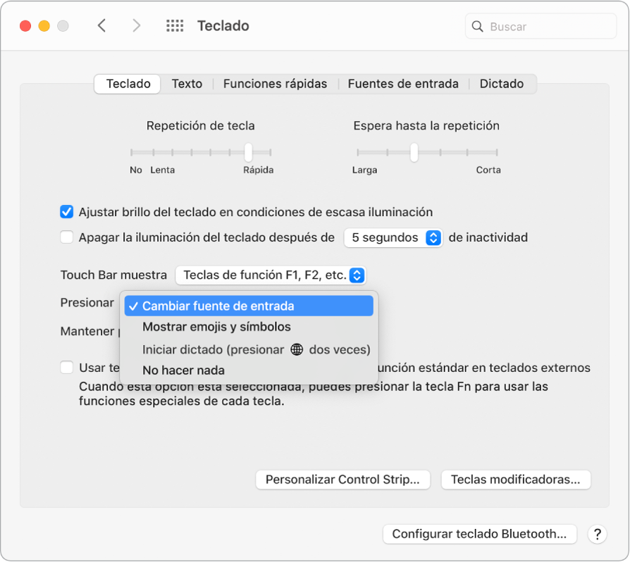 El panel de preferencias Teclado con un menú desplegable que muestra opciones para la tecla Función/Globo terráqueo: cambiar la fuente de entrada; mostrar emojis y símbolos; comenzar dictado, o no hacer nada.