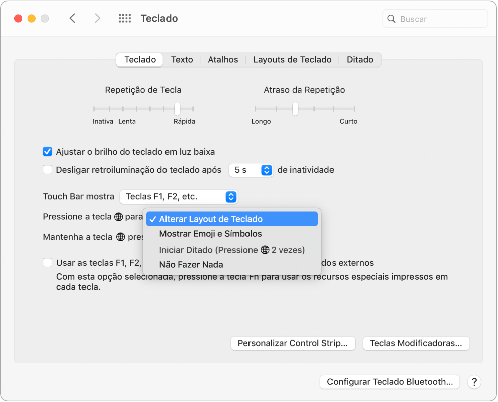 Painel de preferências Teclado com um menu suspenso mostrando opções para a tecla Função/Globo: Alterar Layout de Teclado, Mostrar Emoji e Símbolos, Iniciar Ditado, ou Não Fazer Nada.