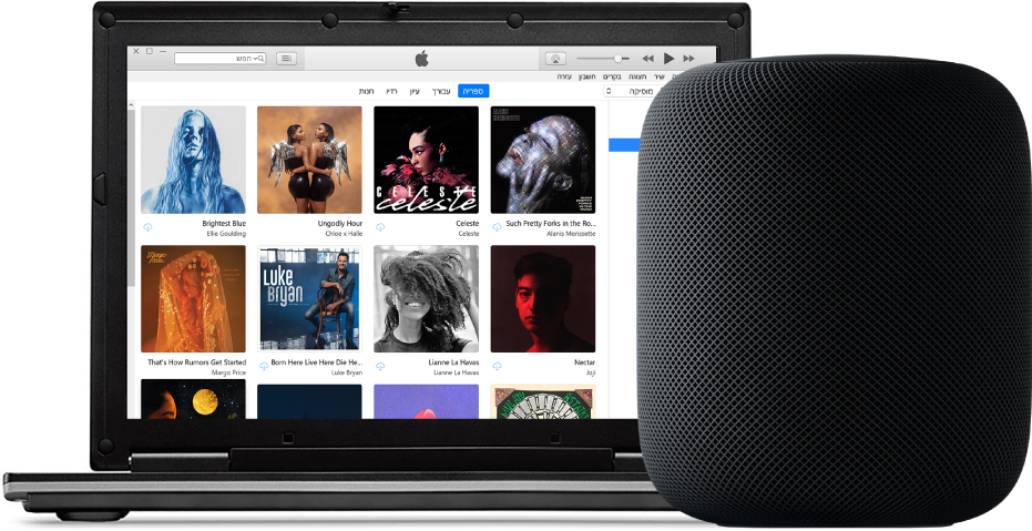 מחשב PC עם תצוגת iTunes על המסך ומכשיר HomePod לידו.