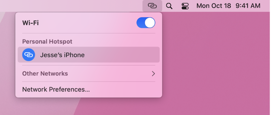 A Mac screen with the Wi-Fi menu showing a Personal Hotspot connected to an iPhone.