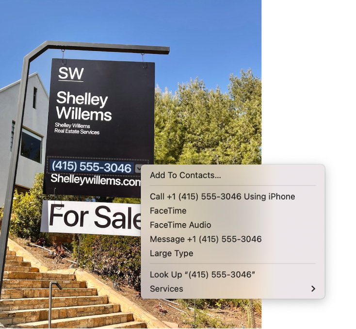 Photo of a Real Estate For Sale sign showing the agent’s phone number selected as Live Text and a menu presenting options to add the phone number to Contacts, call the number, start a FaceTime call, send a text message, and more.