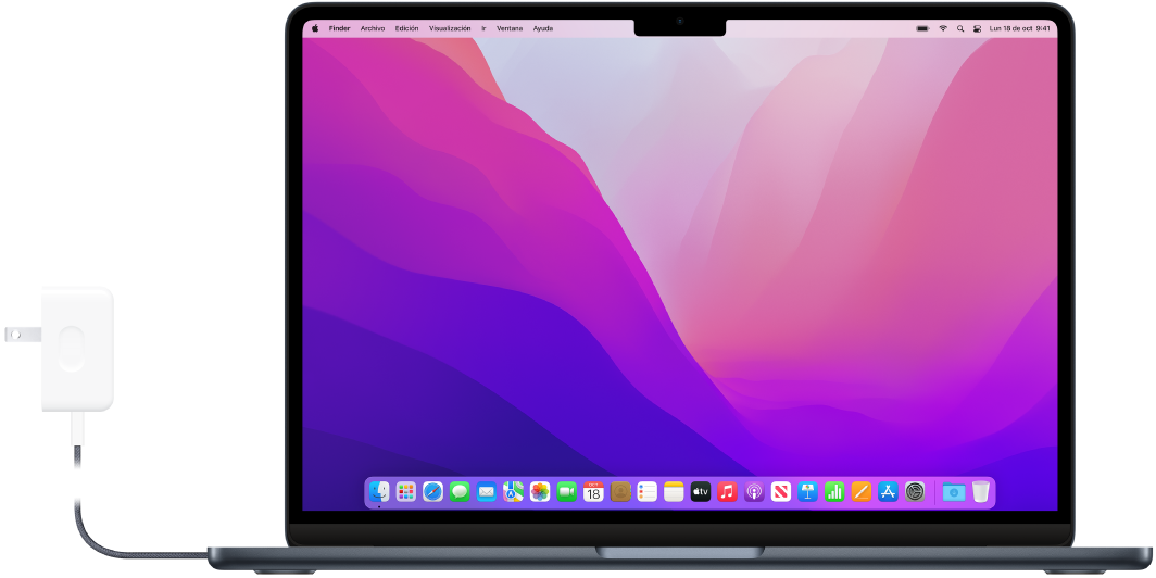 Una MacBook Air con el adaptador de corriente conectado.
