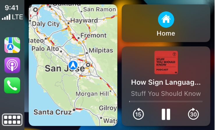 CarPlay Dashboard showing icons for Maps, Podcasts, and Phone on the left, the map of a driving route in the middle, and three items stacked on the right. The top item on the right shows navigation to Gas Stations and Parking. The middle item on the right shows media playback controls. The lower item indicates an upcoming calendar appointment.