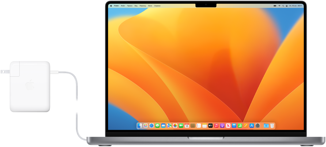 MacBook Pro 16 дюймов с подключенным адаптером питания.