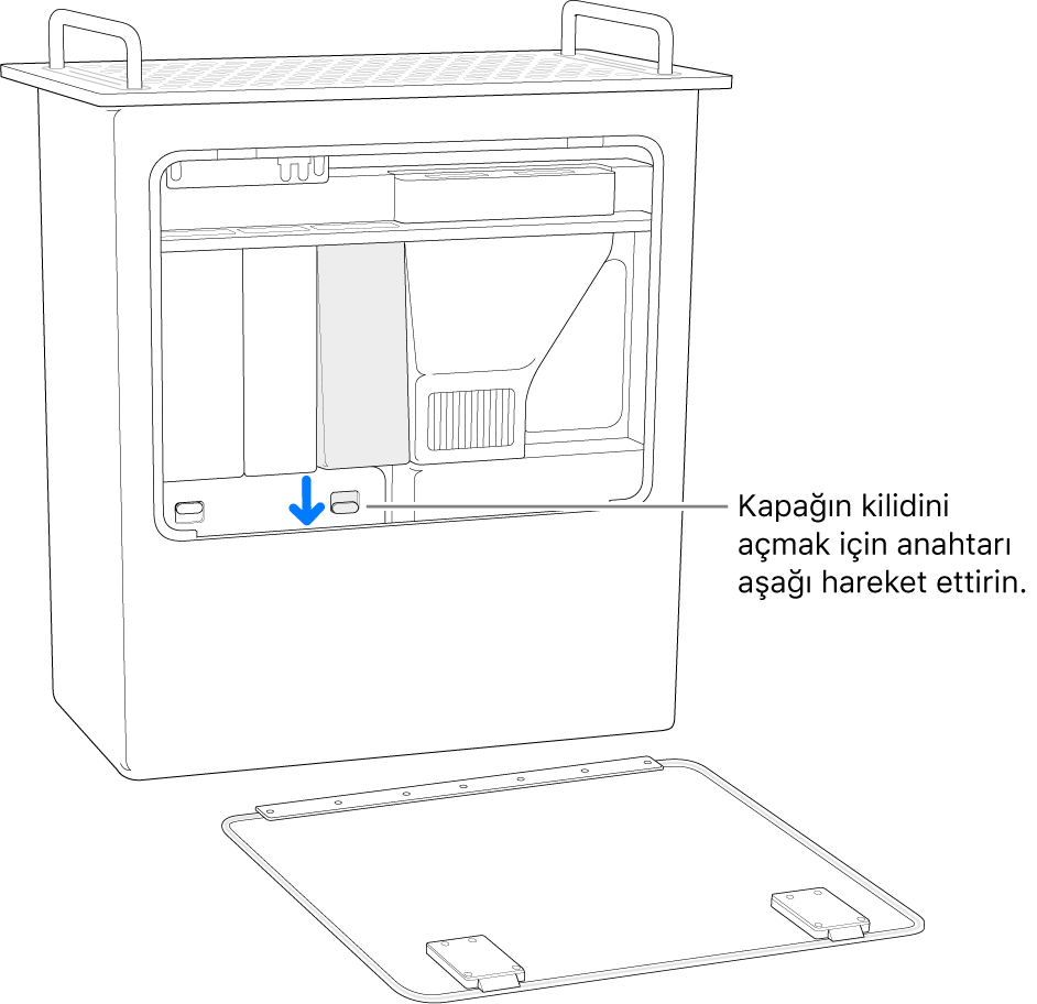 Mac Pro bir kenarında duruyor ve DIMM kapağını açan anahtarlar vurgulanıyor.