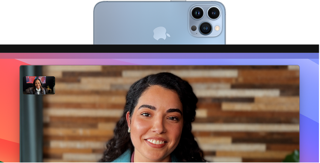 A MacBook Pro showing a FaceTime session with Center Stage using Continuity Camera.