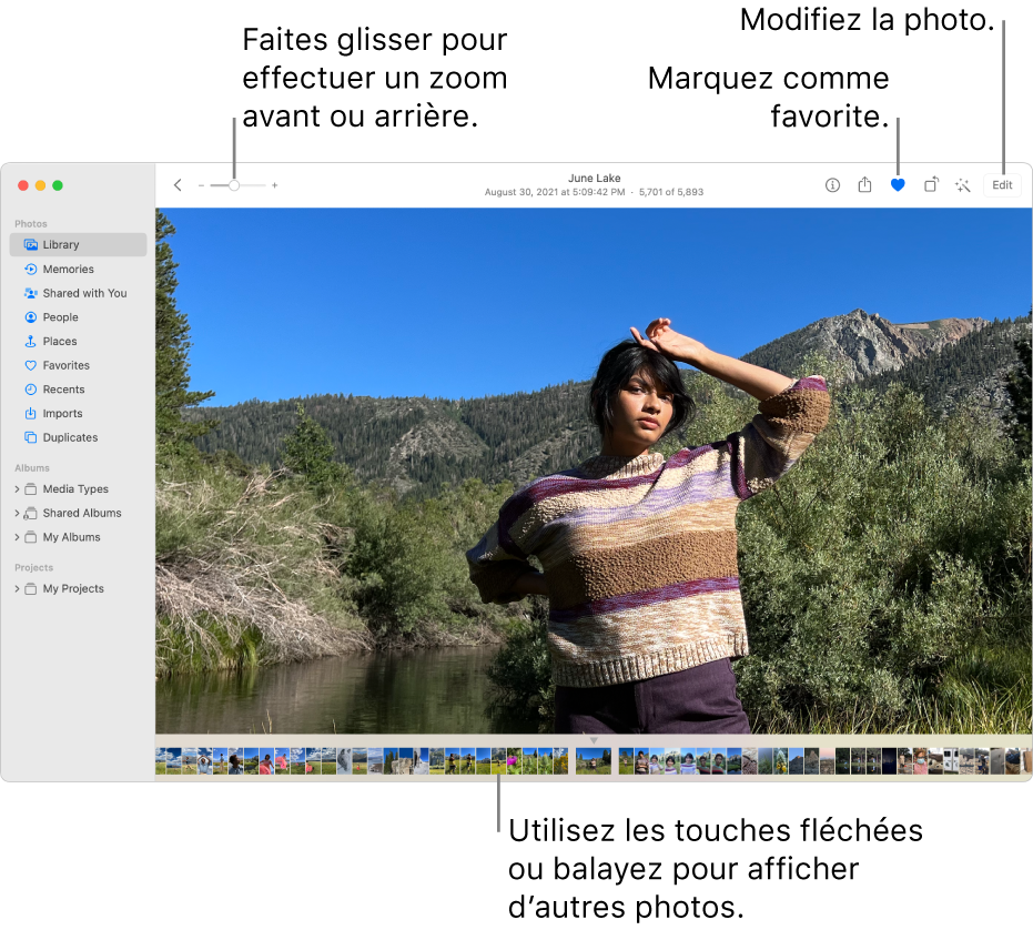 La fenêtre Photos affichant une photo élargie sur la droite avec une rangée de vignettes en dessous. La barre d’outils en haut inclut le curseur Zoom, le bouton Favori et le bouton Modifier.