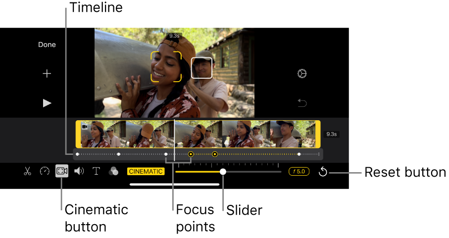 A Cinematic mode video clip in the viewer, with yellow brackets around the object currently in focus and a white box around an object not in focus. The timeline shows white and yellow focus points.