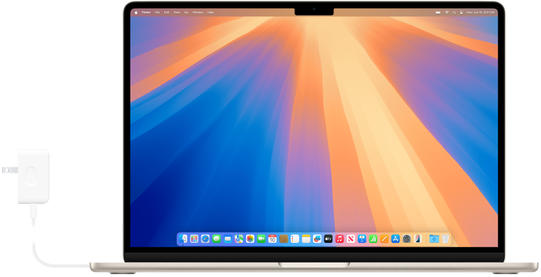 Un MacBook Air con el adaptador de corriente conectado.