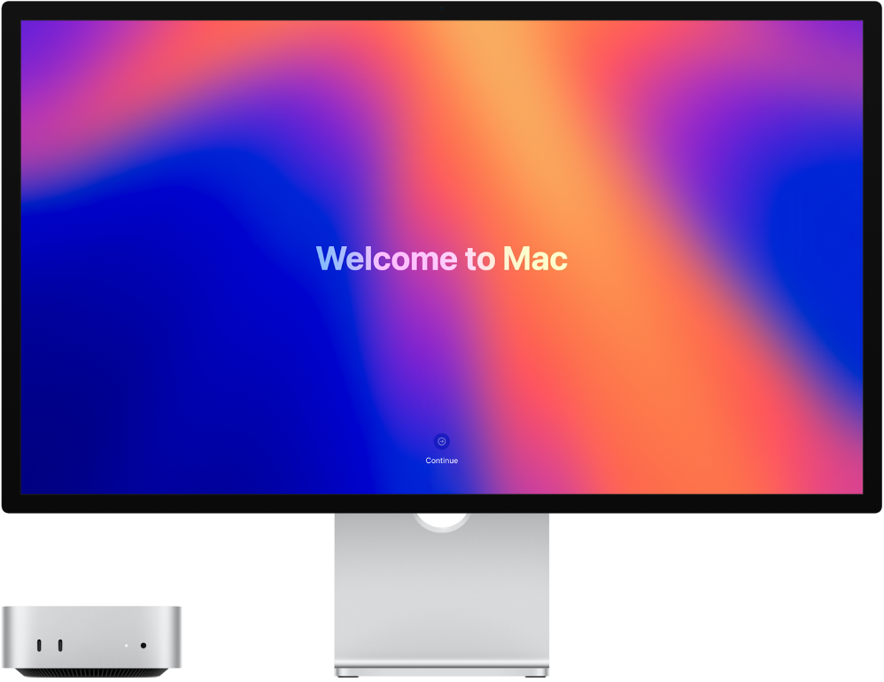 Ένα Mac mini και μια οθόνη Studio Display δίπλα-δίπλα με τις λέξεις «Καλωσορίσατε στο Mac» στην οθόνη.