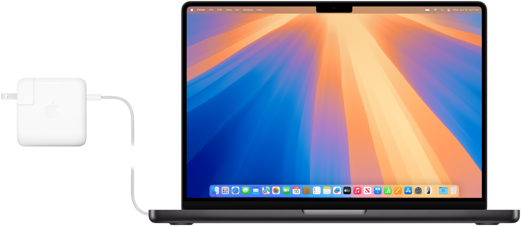 14-palčni računalnik MacBook Pro s priključenim napajalnikom.