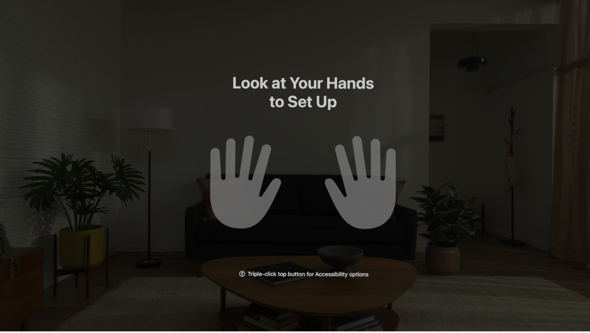 Hand setup on Apple Vision Pro, instructing the user to look at their hands in front of them.