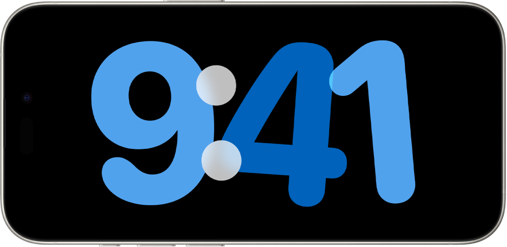 An iPhone in StandBy, charging and standing on its side, with a digital clock showing on the screen.