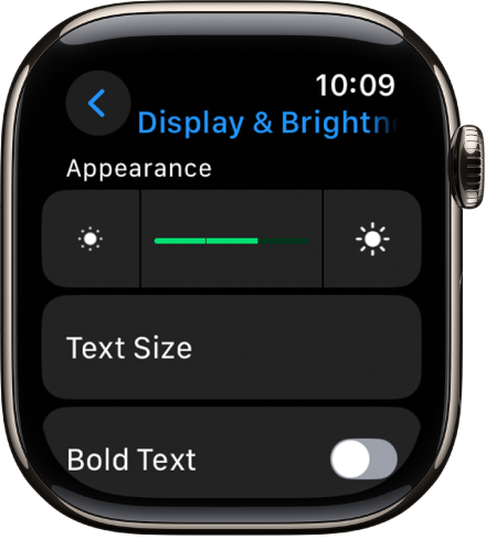 La configuració “Pantalla i brillantor” a l’Apple Watch, amb el regulador de brillantor a la part superior i el botó de “Mida del text” a sota.