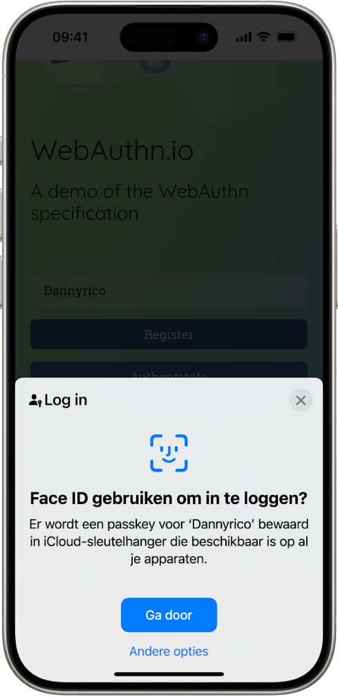 In de onderste helft van het iPhone-scherm staat de optie om met passkeys op een website in te loggen. Er is een knop 'Ga door' om een passkey te bewaren, en een knop 'Andere opties'.