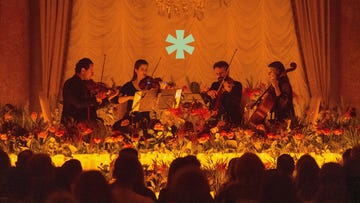 string quartet performance in a floral setting